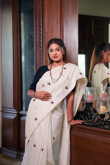 Off-White Cotton Saree with Maroon Embroidered Motifs & Subtle Gold Dot Texture